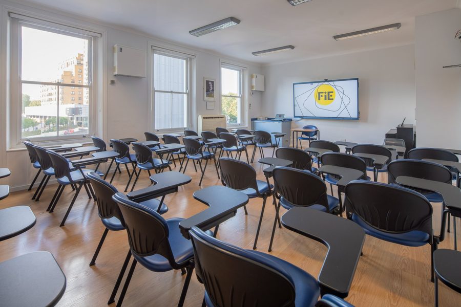 Foundation House classroom with an 86-inch Clevertouch touchscreen and street-facing windows