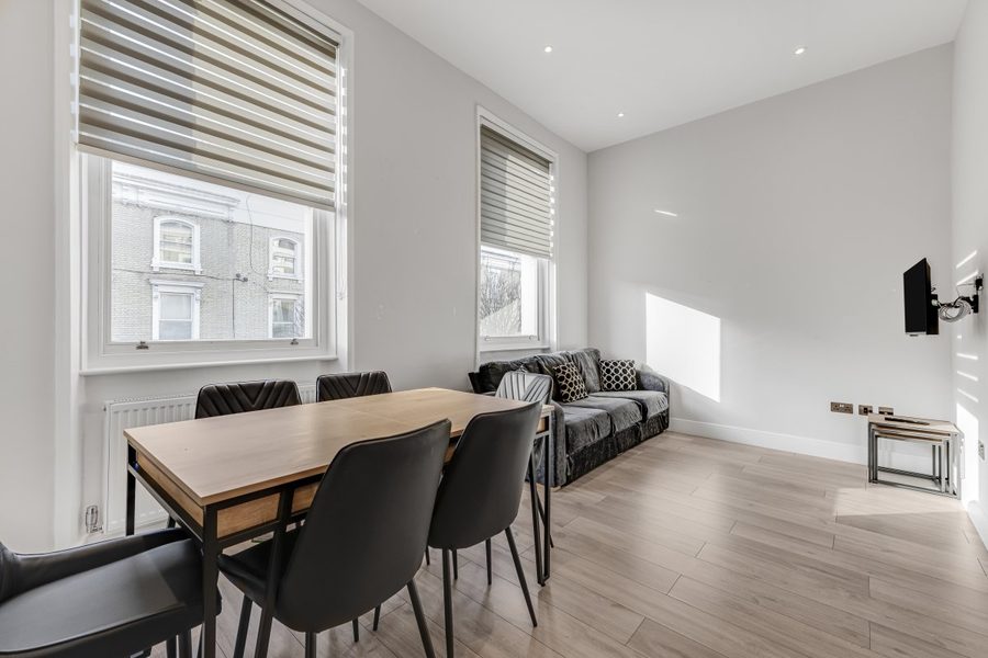 Dining table and lounge in a Finborough Road faculty apartment